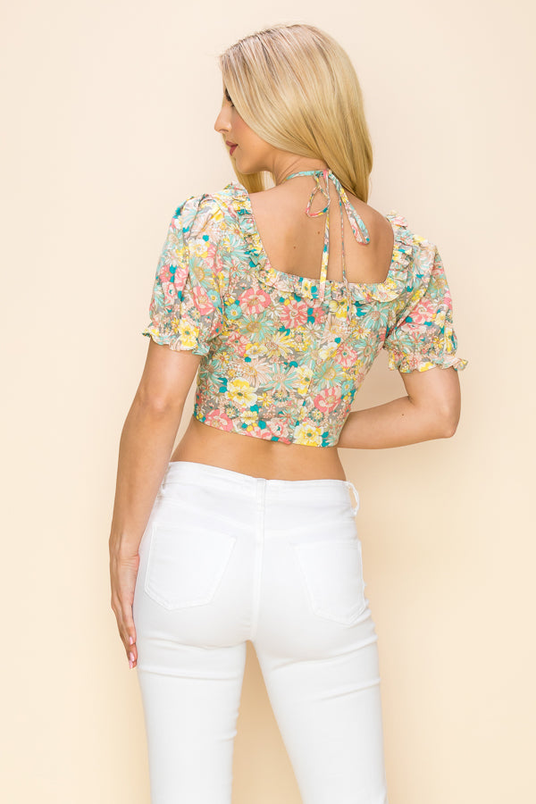 Multi color floral crop top with short sleeves and cut out design