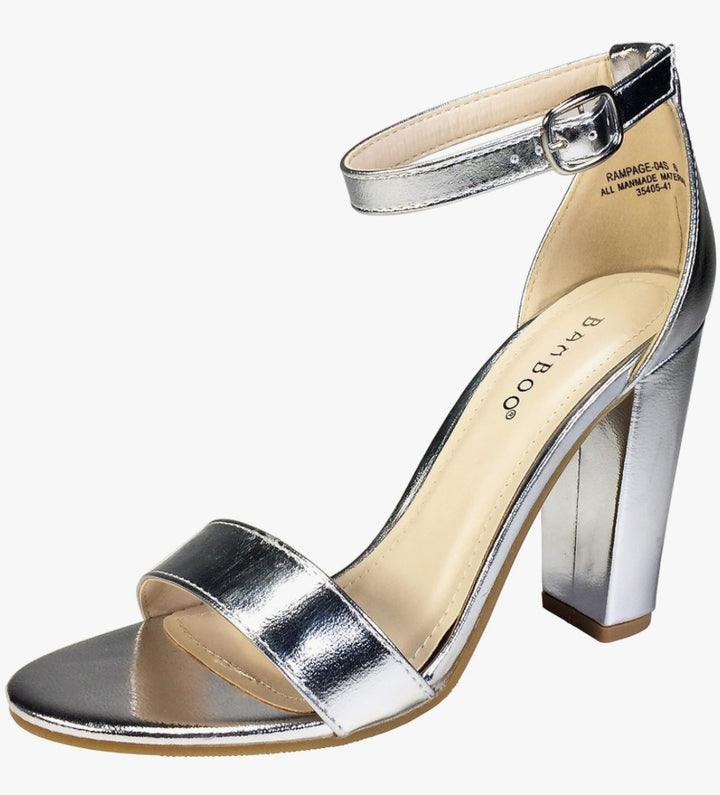 A pair of silver metallic sandals with ankle straps.
